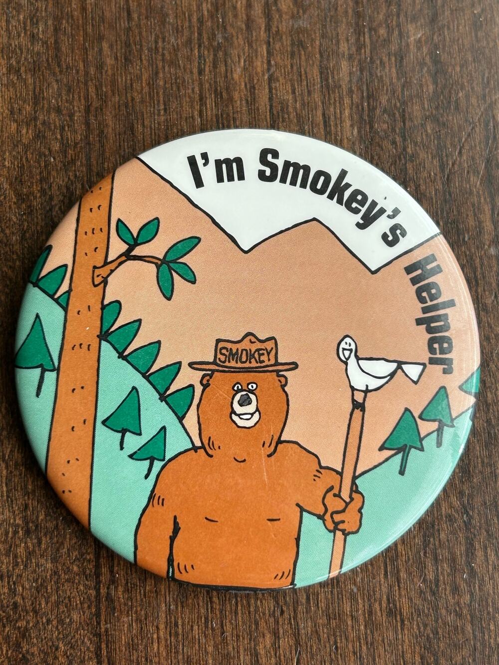 Vintage 3-inch "I'm Smokey's Helper" pinback button featuring Smokey Bear